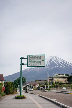 Picturesque street view with Mount Fuji in the background, capturing Japanese suburban life.
