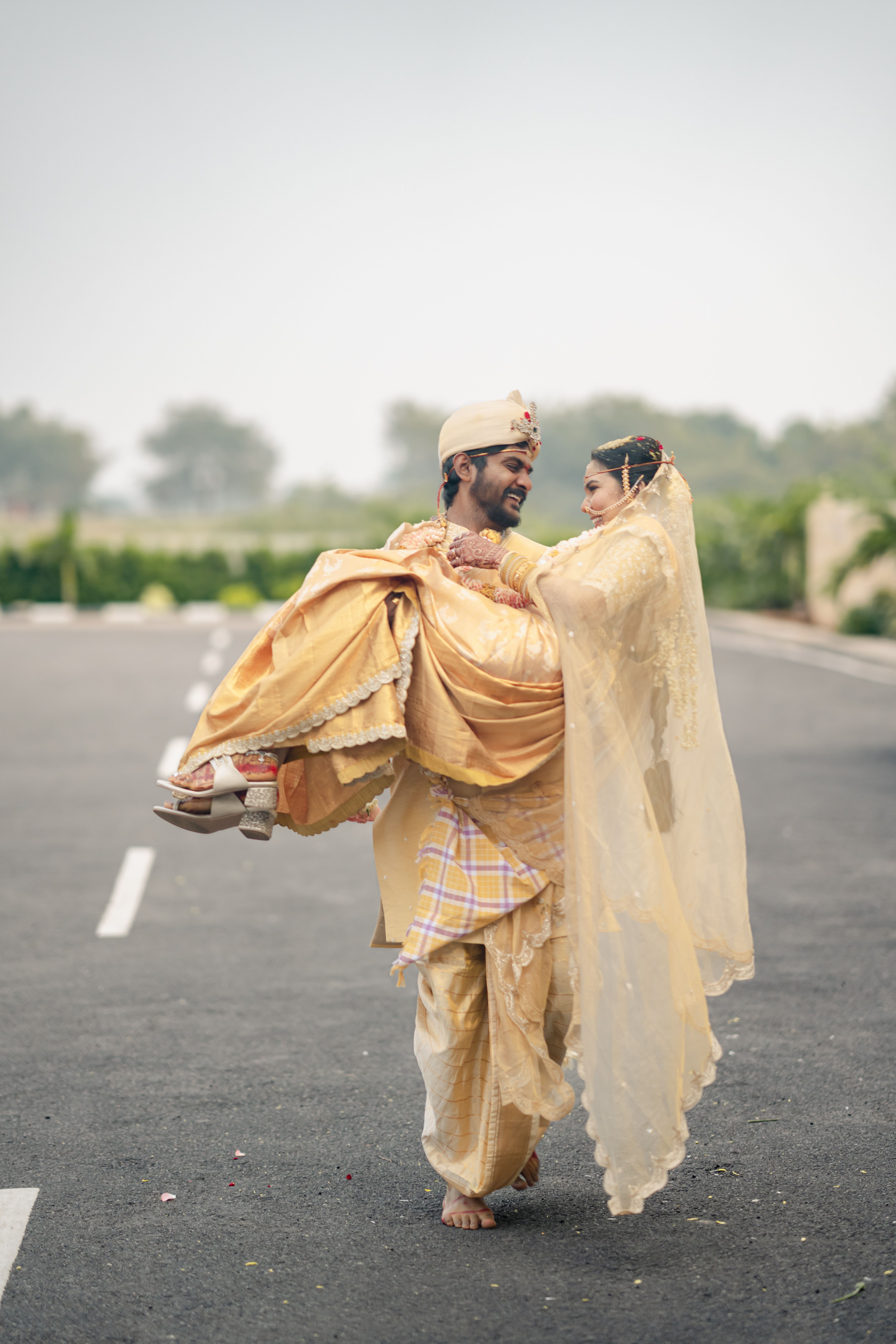 Joyful Indian Wedding Couple in Traditional Attire · Free Stock Photo