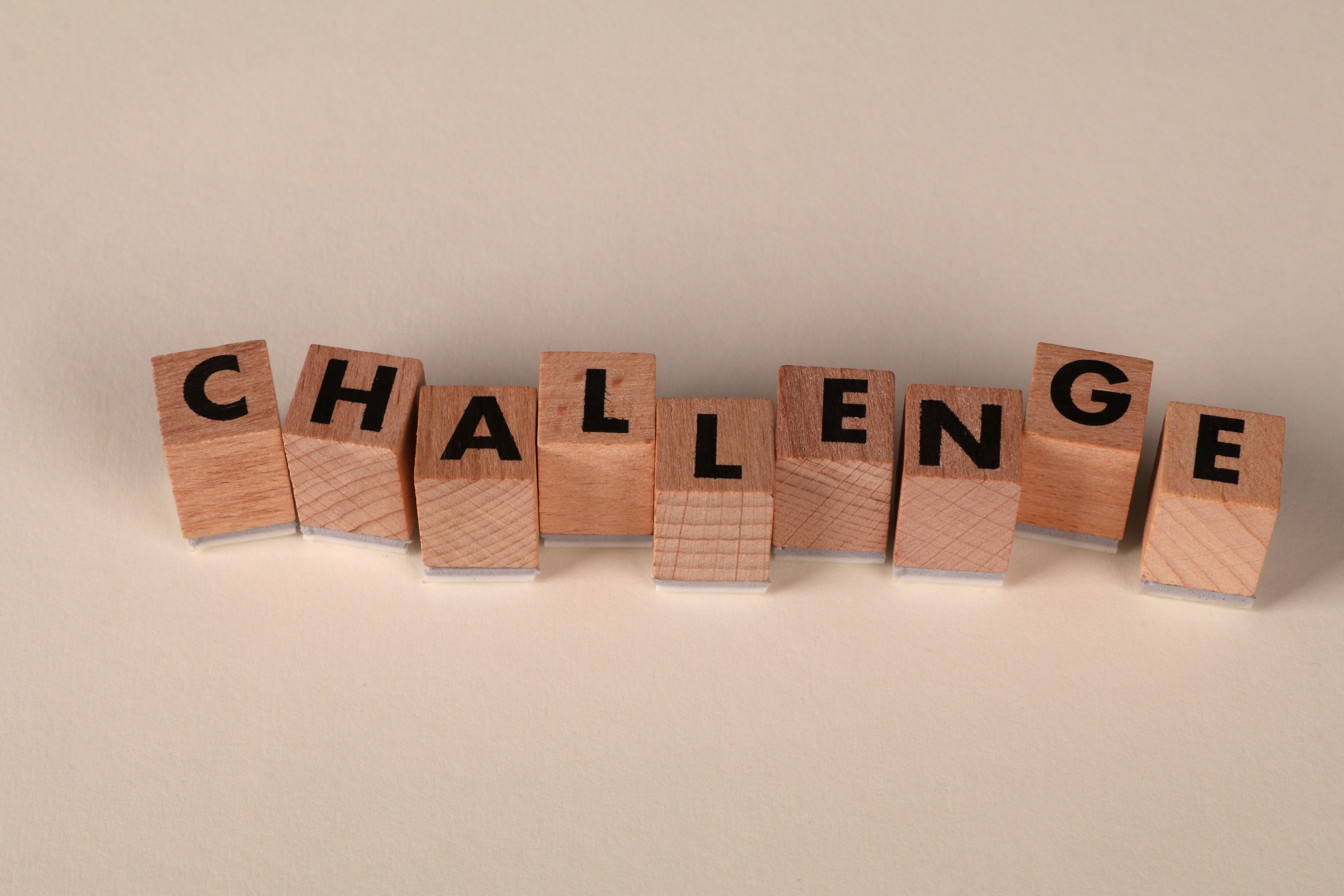 Wooden Blocks Spelling 'Challenge' on Neutral Background · Free Stock Photo