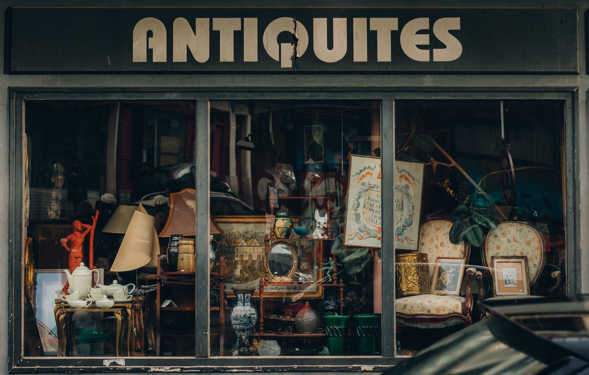 Antique and vintage glassware displayed on shelf