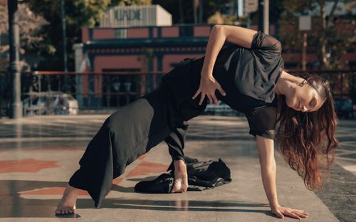 Free A woman performing a contemporary dance pose outdoors in Buenos Aires, Argentina. Stock Photo