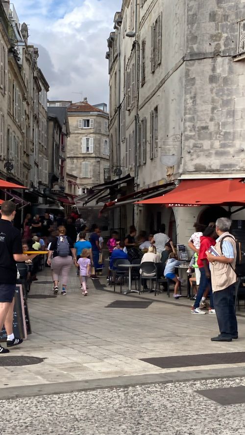 Free Busy street with outside dining  in La Rochelle  Stock Photo