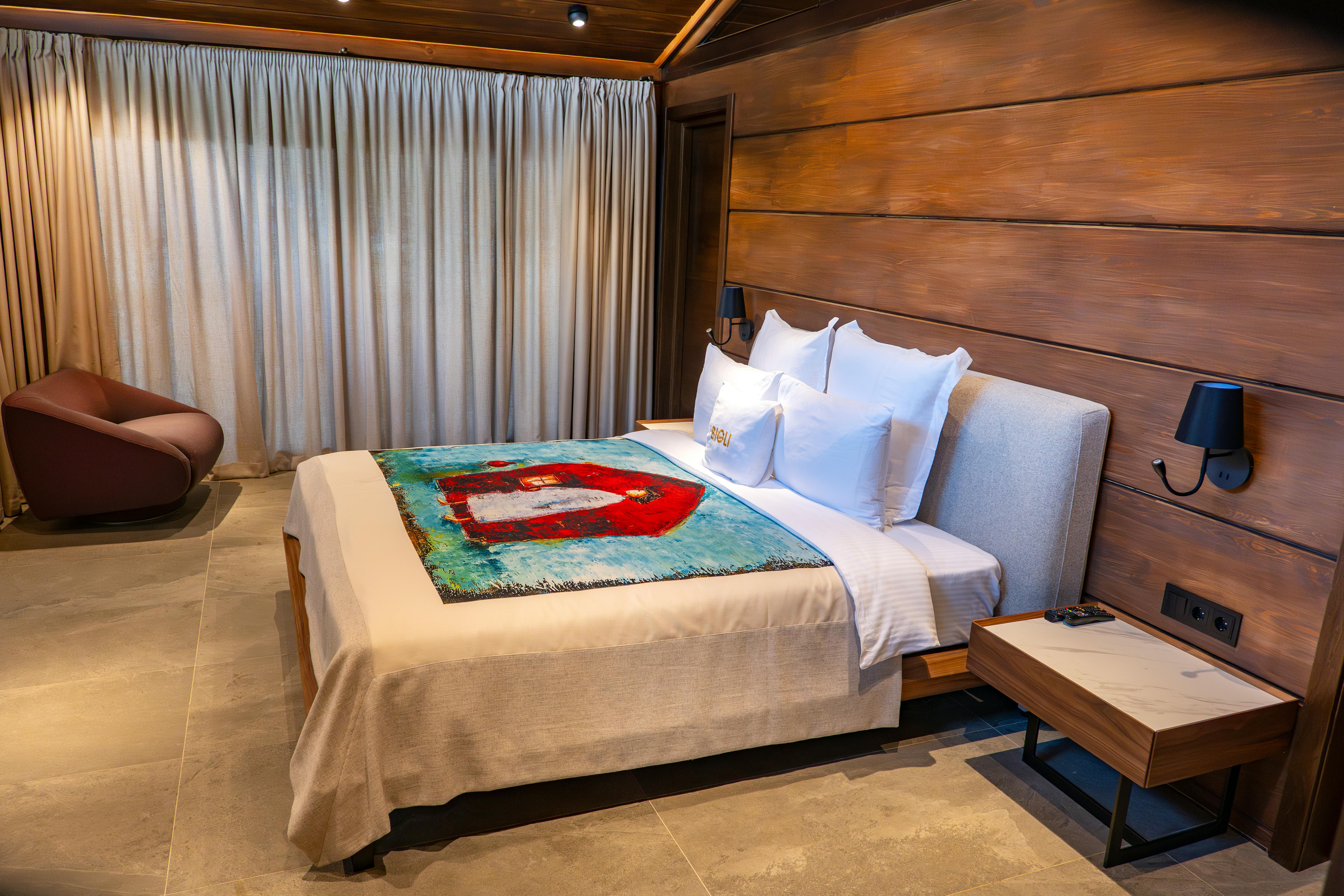 Elegant modern bedroom with artistic decor in Tbilisi, Georgia.