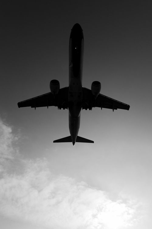 Silhouette of Airplane Against Dramatic Sky · Free Stock Photo