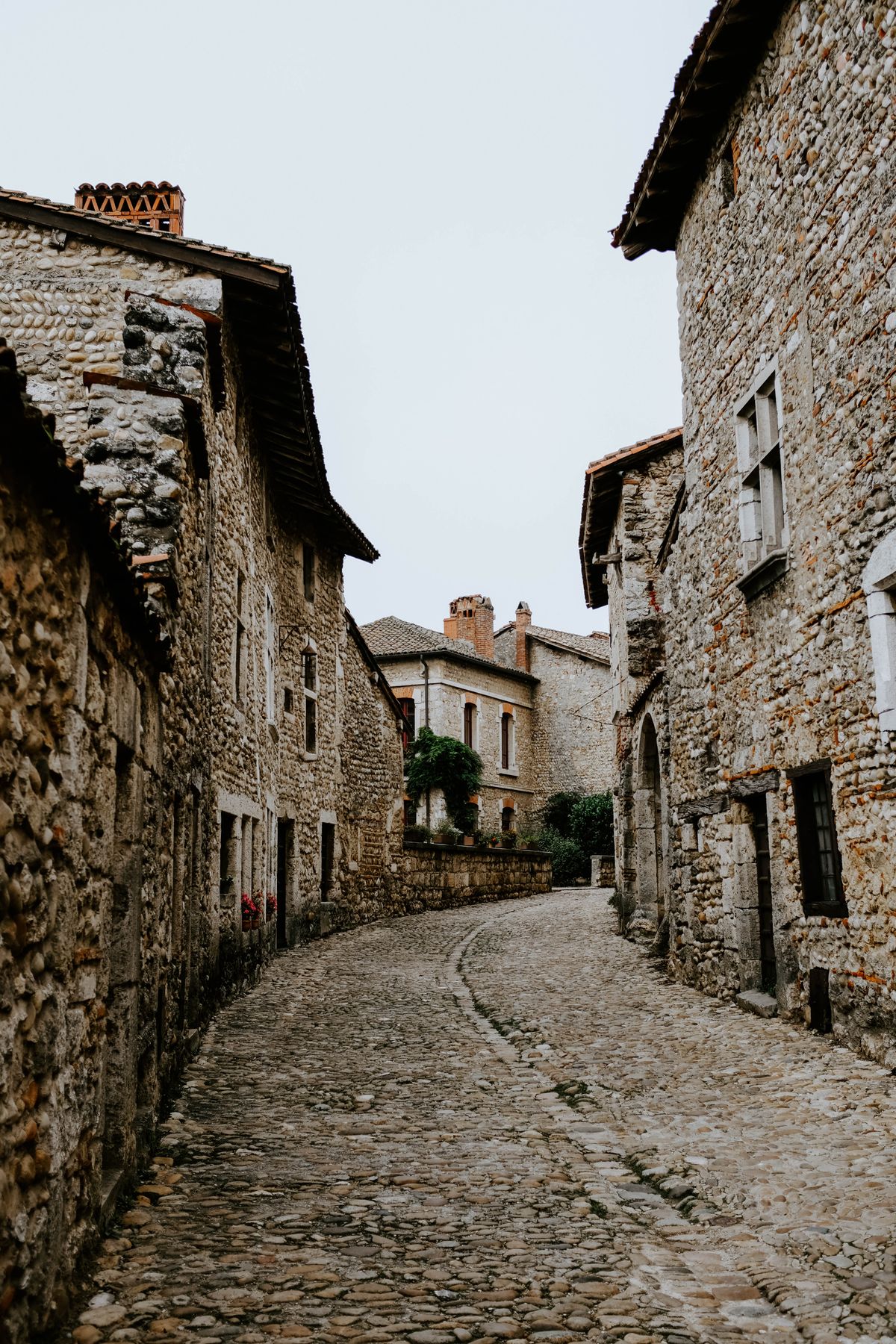 Old cobbled street with stone buildings, Mediterranean atmosphere