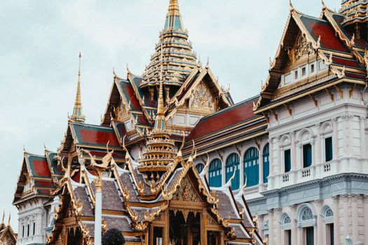 Ornate Thai architecture with golden details at Bangkok's Grand Palace.