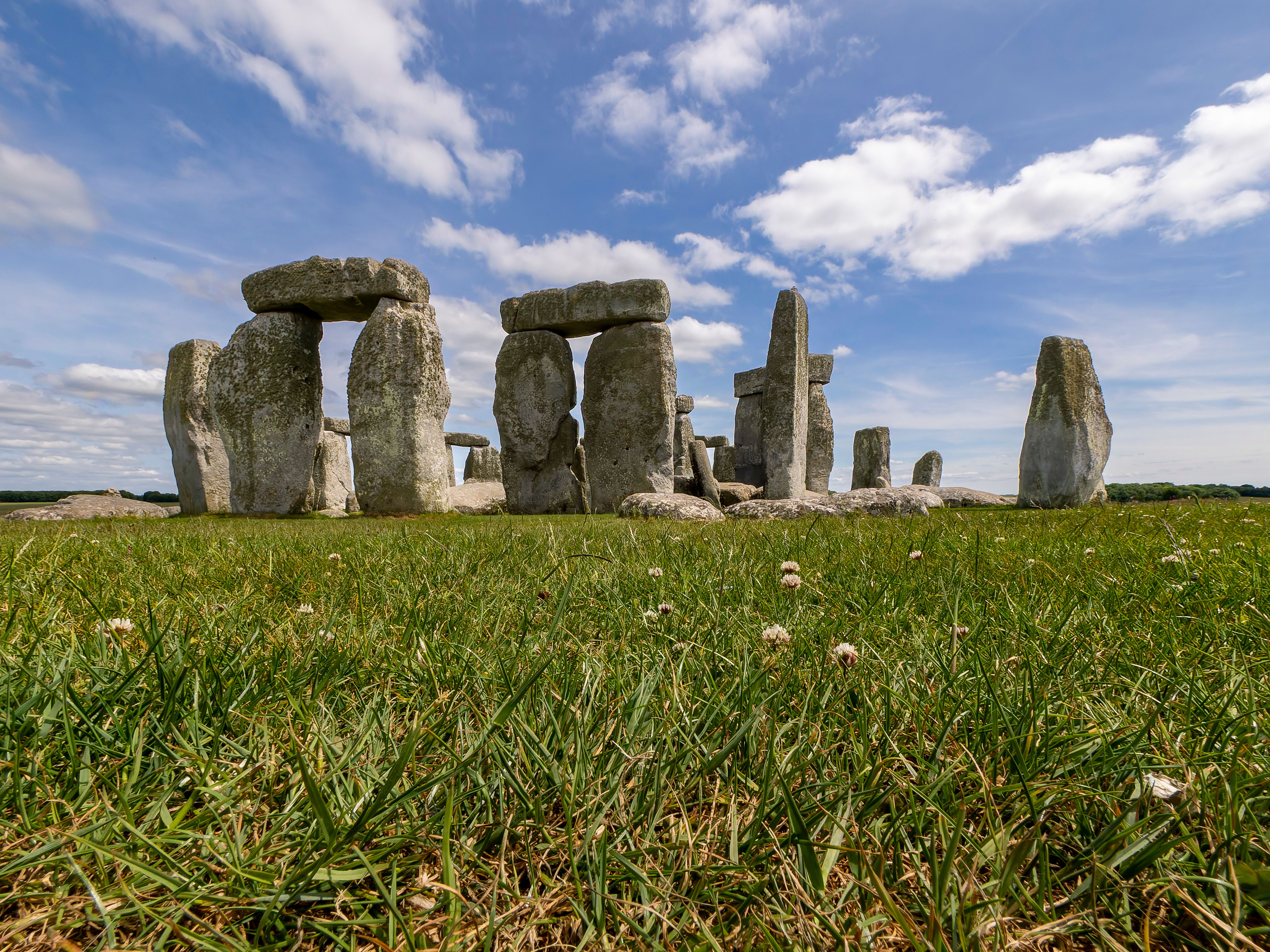 Stonehenge stone circle with clear skies, highlighting ancient Neolithic heritage in England.