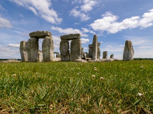 Free Stonehenge stone circle with clear skies, highlighting ancient Neolithic heritage in England. Stock Photo