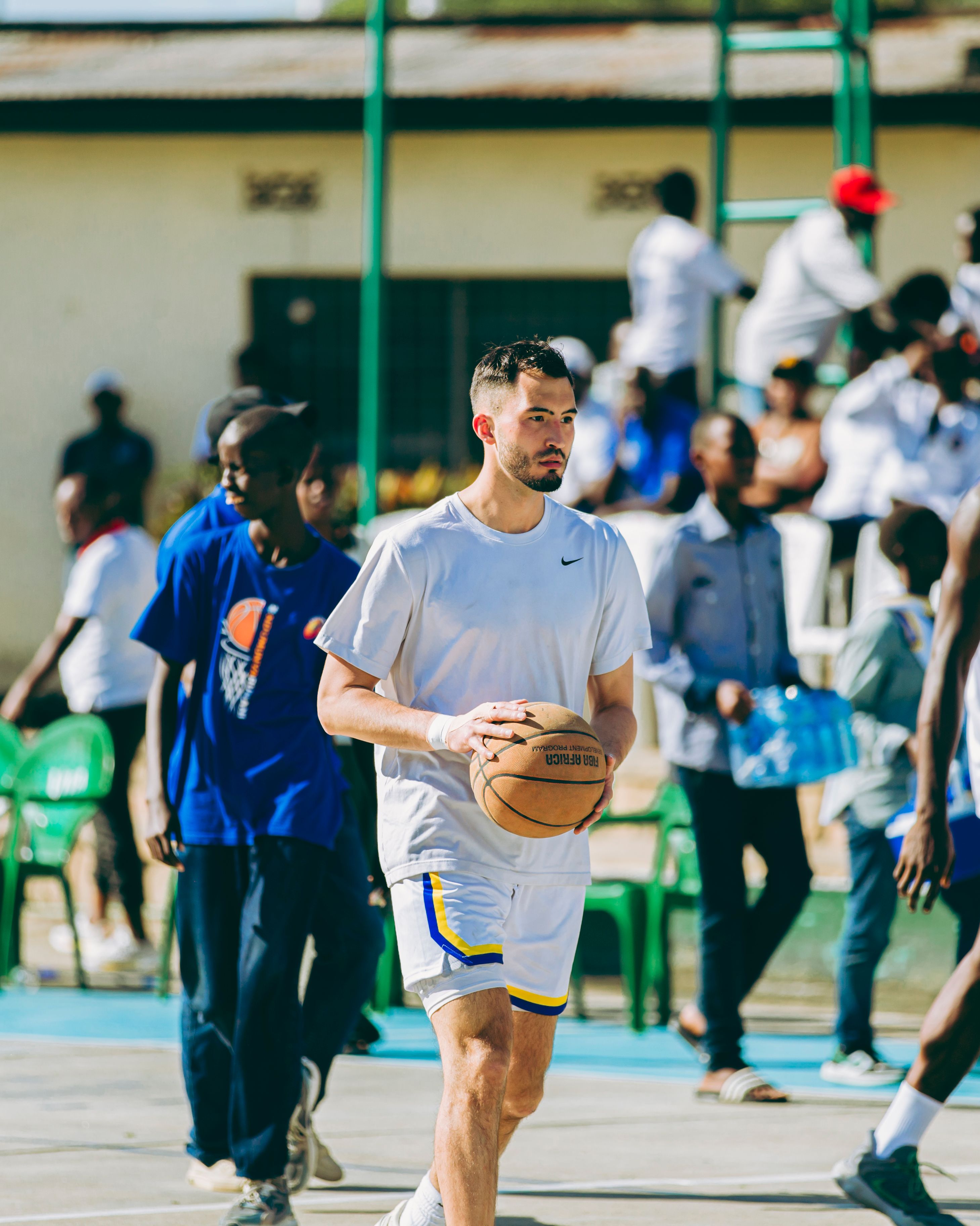Outdoor Basketball Game with Diverse Players · Free Stock Photo