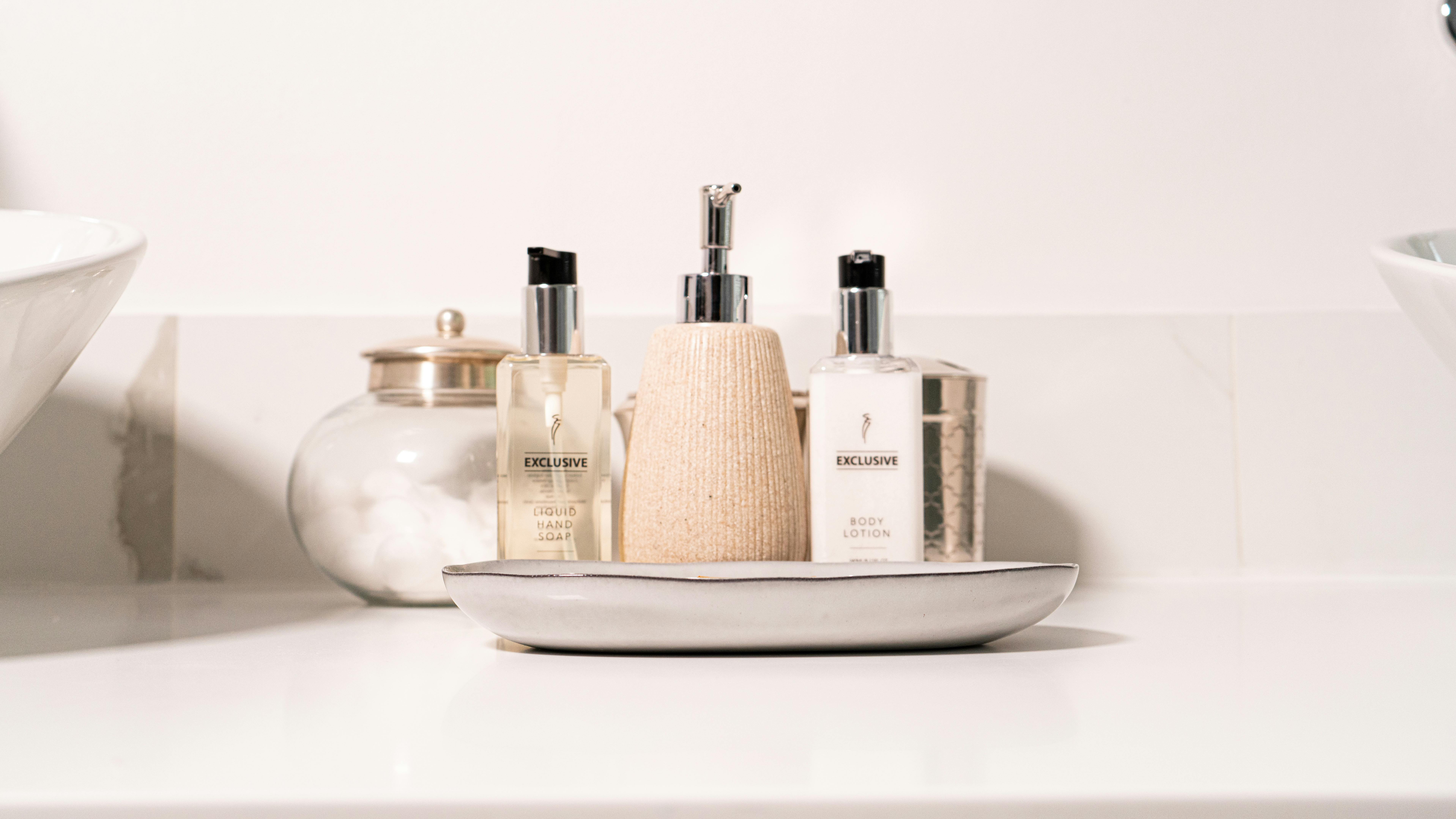 Minimalist bathroom setup with hand soap and lotion in a modern setting.