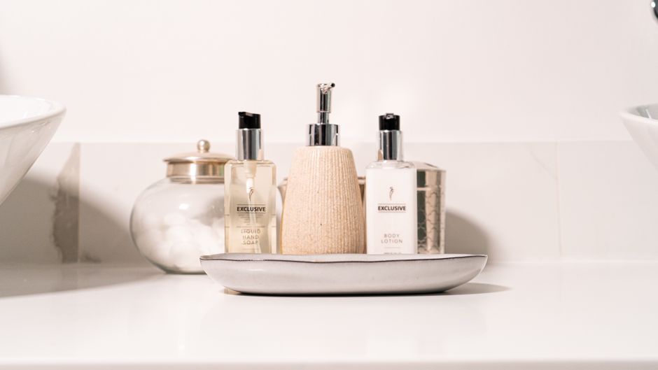 Bath and body products placed on a bathroom counter