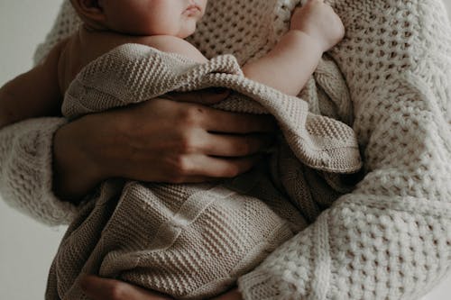 Free Woman Carrying A Baby  Stock Photo