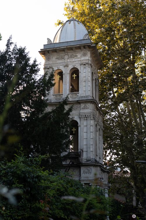 Free Beautiful historic bell tower surrounded by lush trees in Istanbul, Turkey. Stock Photo