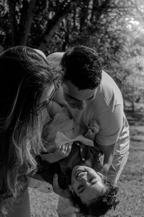 Free A joyful family moment captured outdoors in São Paulo, showing happiness and connection. Stock Photo