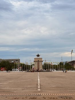 Image showing aftermath of Bengaluru stampede.  A grieving father amidst the chaos; highlights the national tragedy and loss of life.