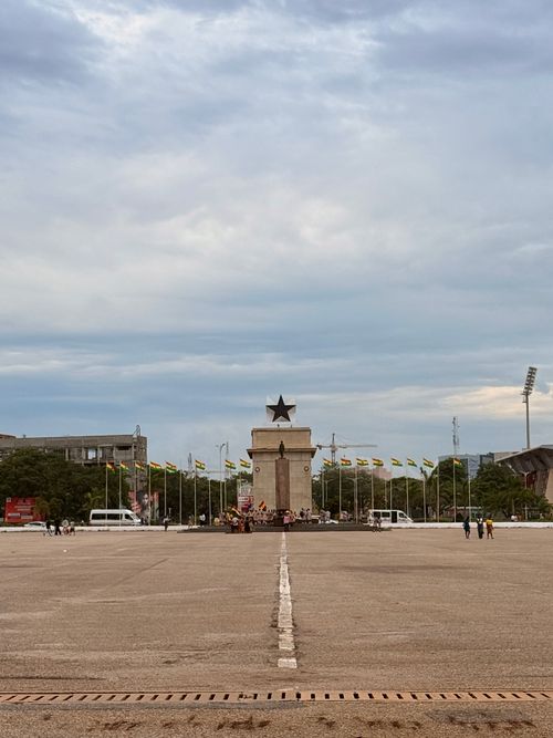 Free View of Black Star Square with flags and sky backdrop in Accra, Ghana. Stock Photo