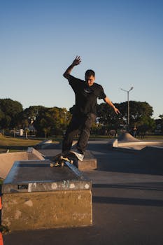 A skilled skateboarder performing a trick at a skatepark during sunset in Buenos Aires.