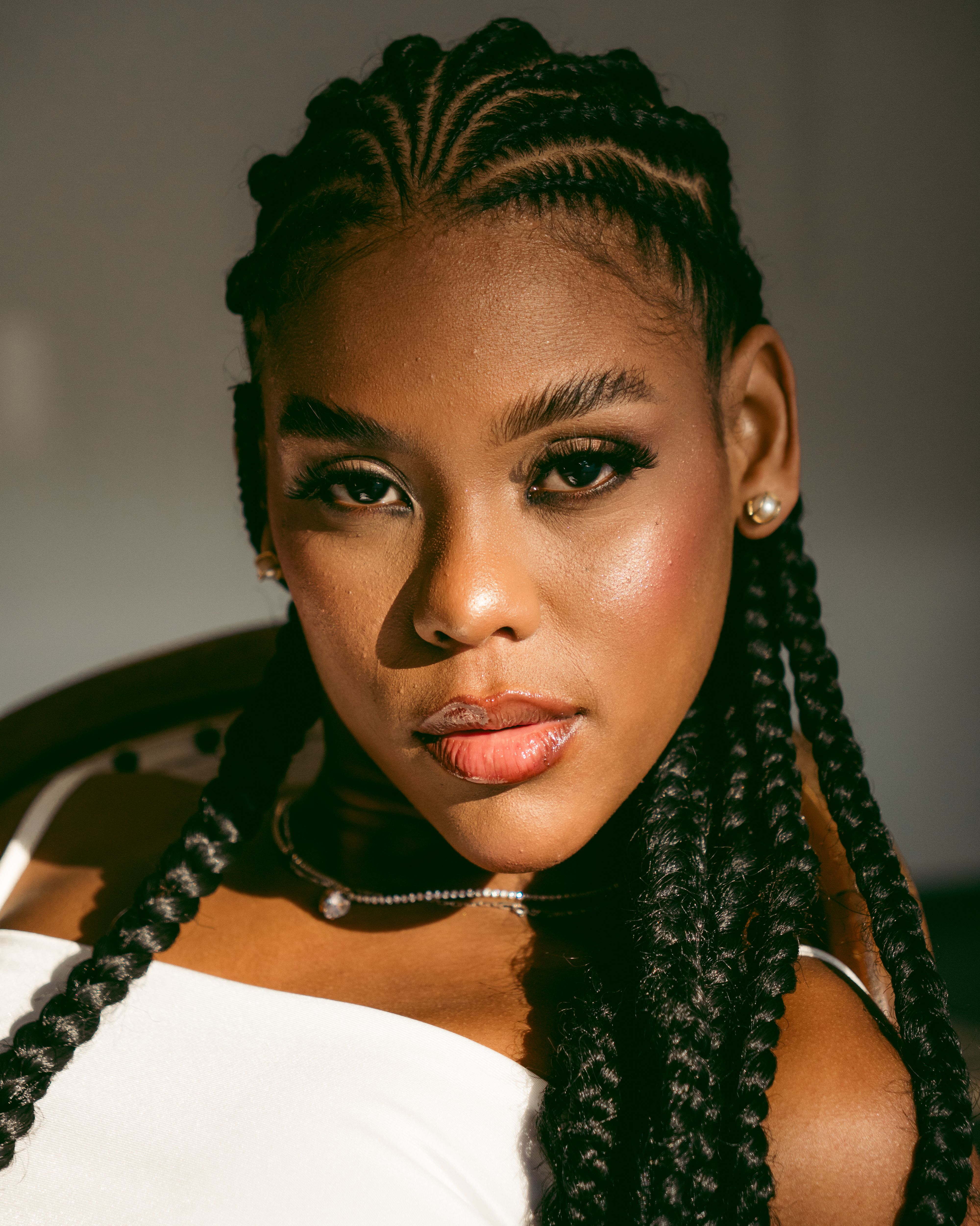 Portrait of a Stylish Woman with Braided Hair · Free Stock Photo