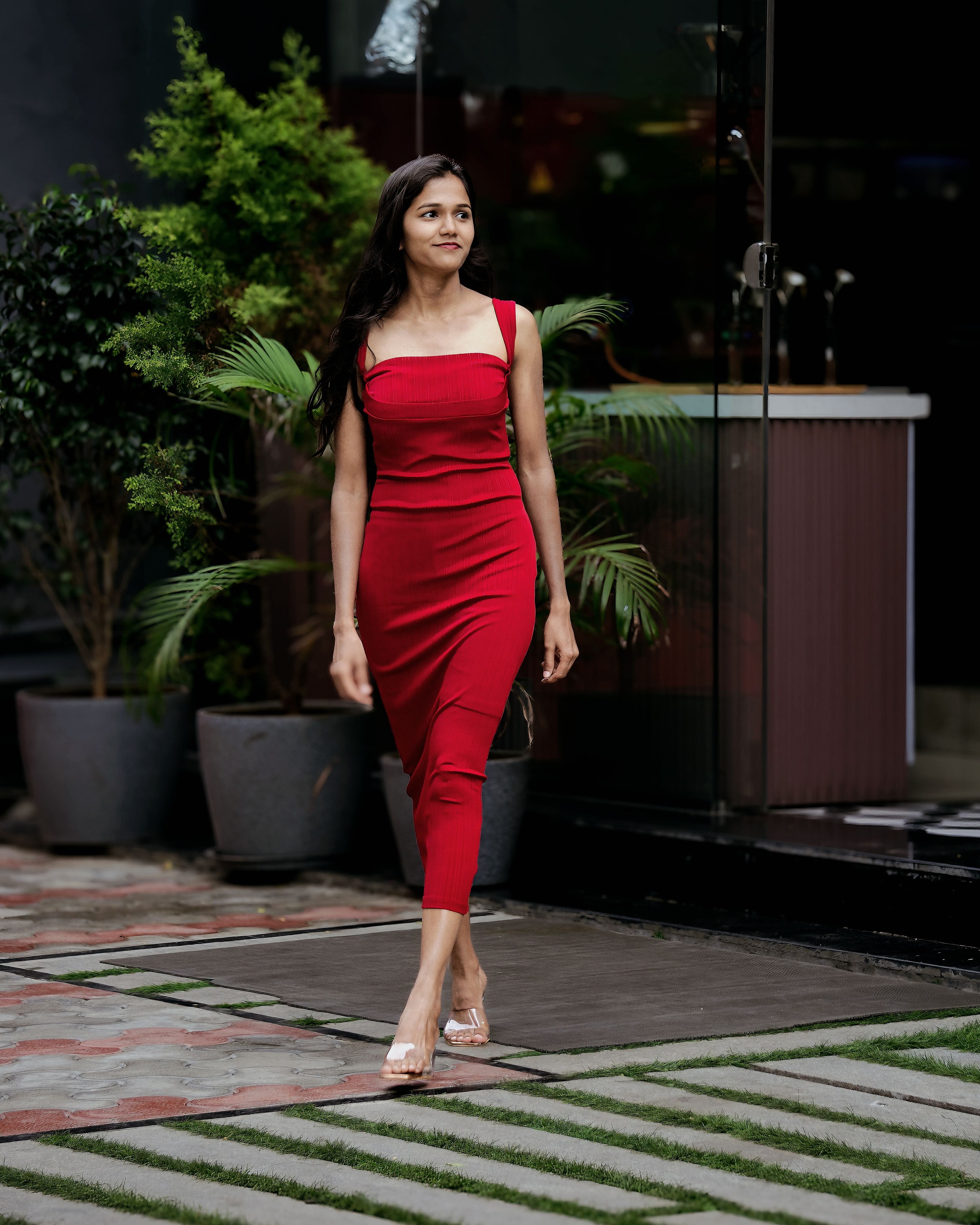 Elegant Woman in Red Dress Walking Outdoors · Free Stock Photo