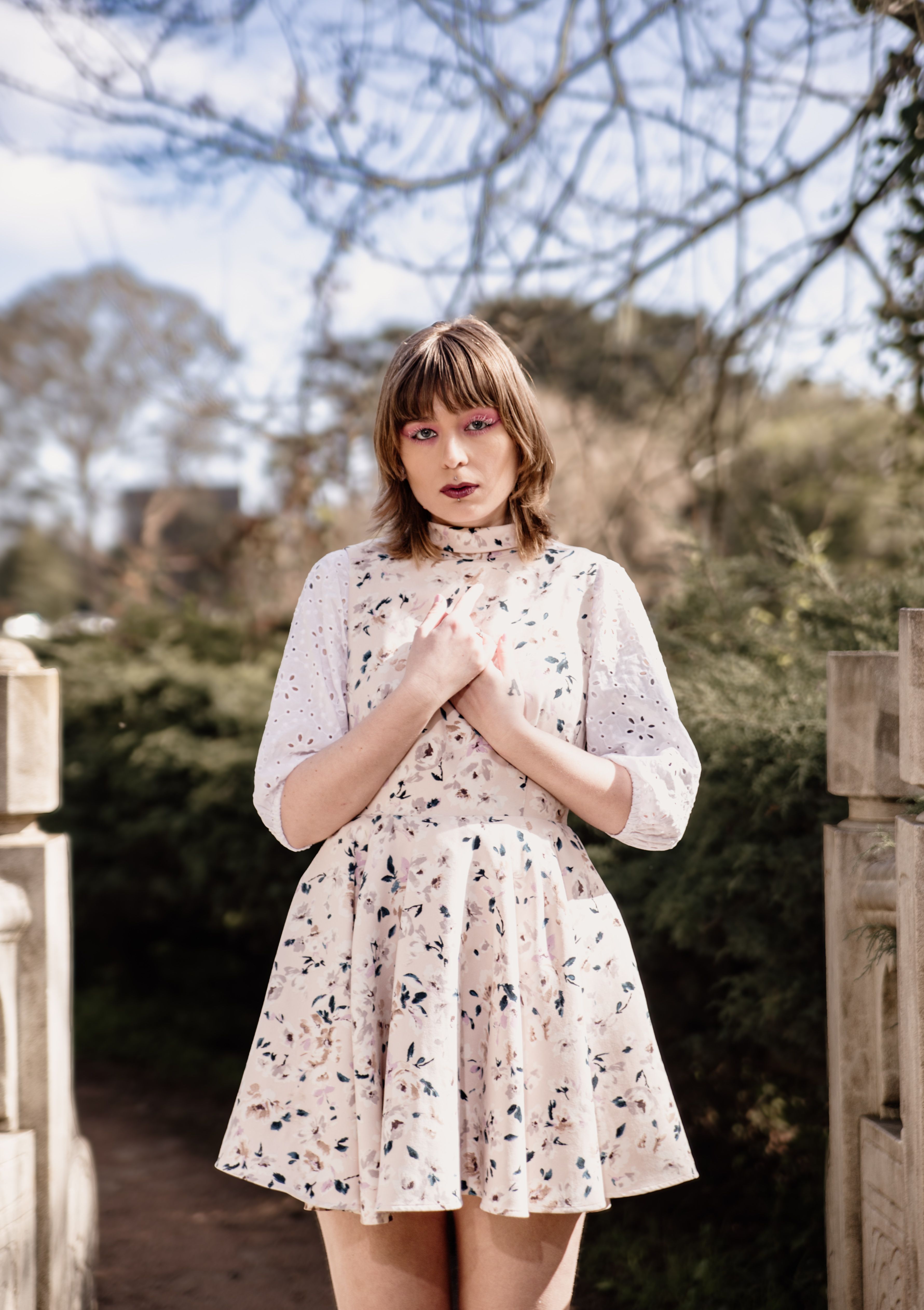 Young Woman in Floral Dress Outdoors · Free Stock Photo