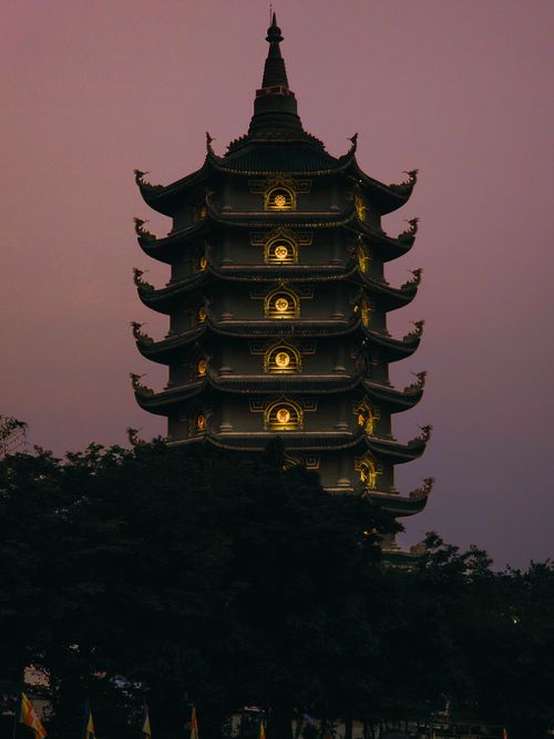 Free Stunning view of a lit pagoda against a twilight sky, showcasing traditional Vietnamese architecture. Stock Photo