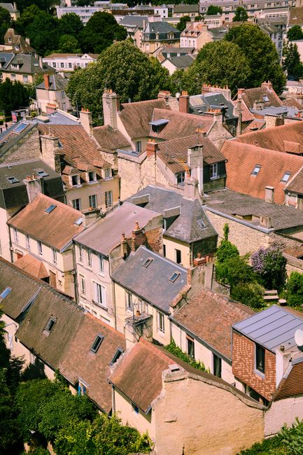 Aerial view of traditional architecture in Caen, Normandy, showcasing historical French rooftops.
