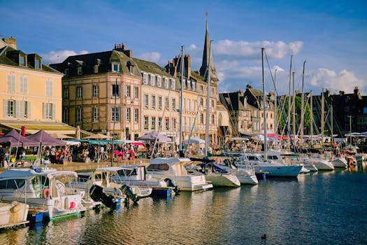 A picturesque view of Honfleur Marina in Normandy, France with boats and historic architecture.