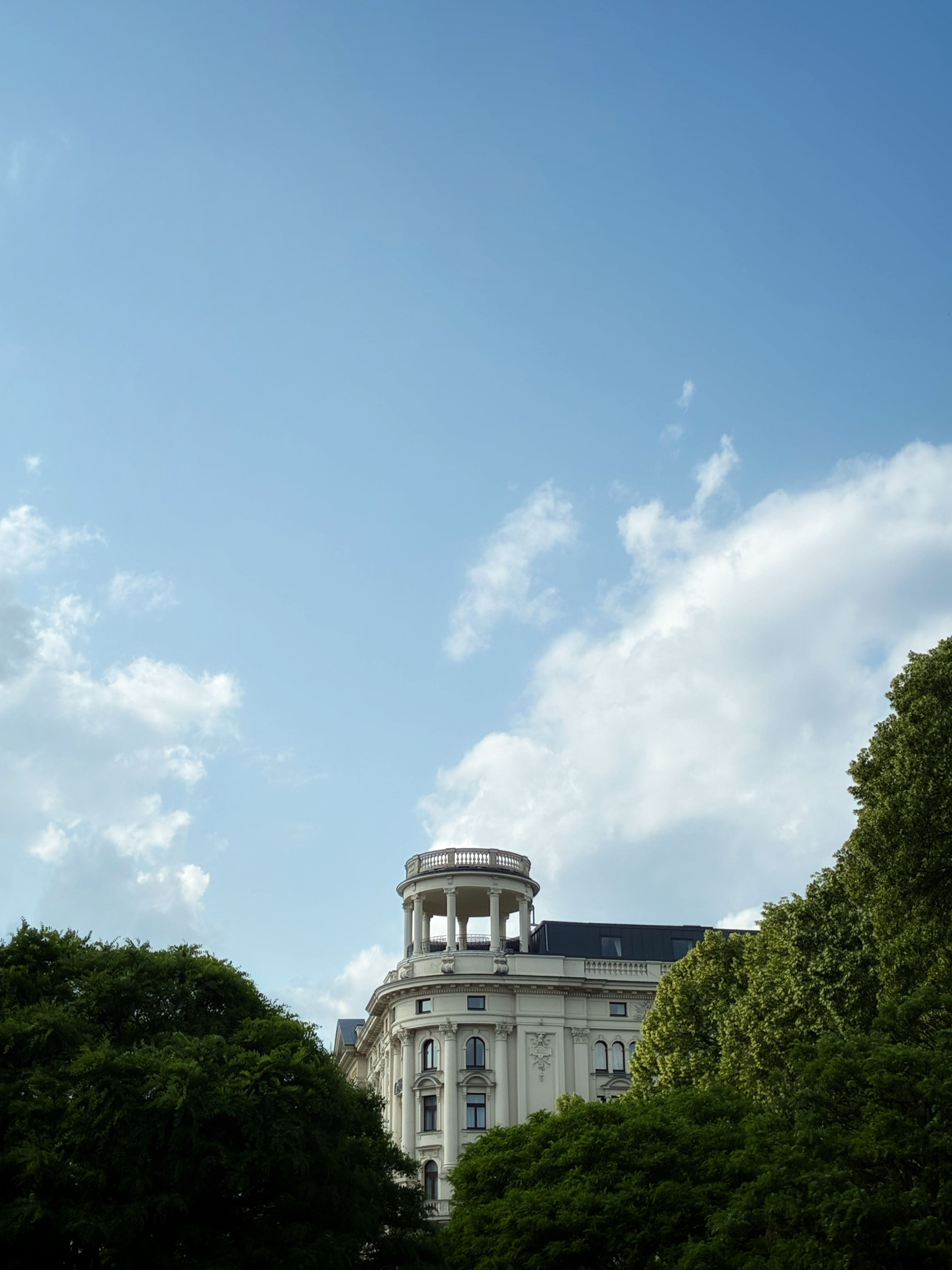 Historic Building Against Blue Sky with Clouds · Free Stock Photo