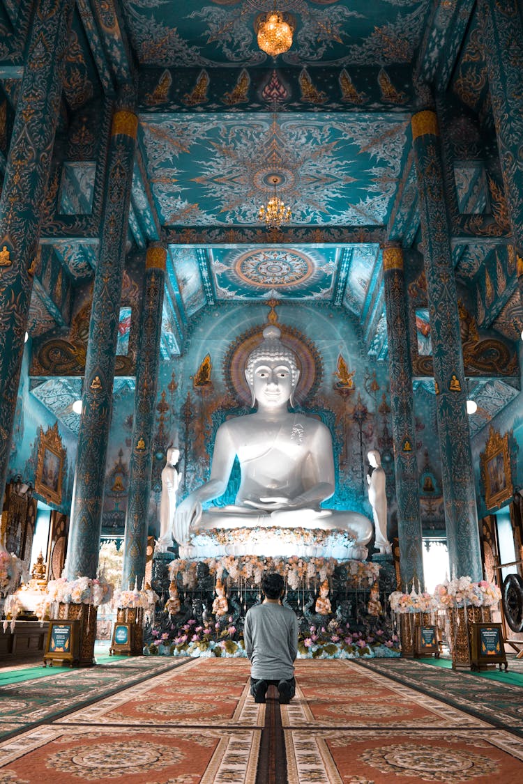 Peron Praying At Buddha For Good Luck