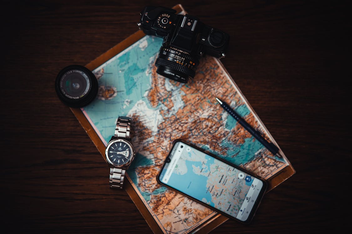 Free Smartphone Beside Watch and Camera Stock Photo