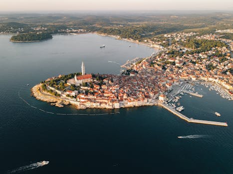 Stunning aerial view of Rovinj's historic peninsula with red rooftops by the Adriatic Sea in Croatia.