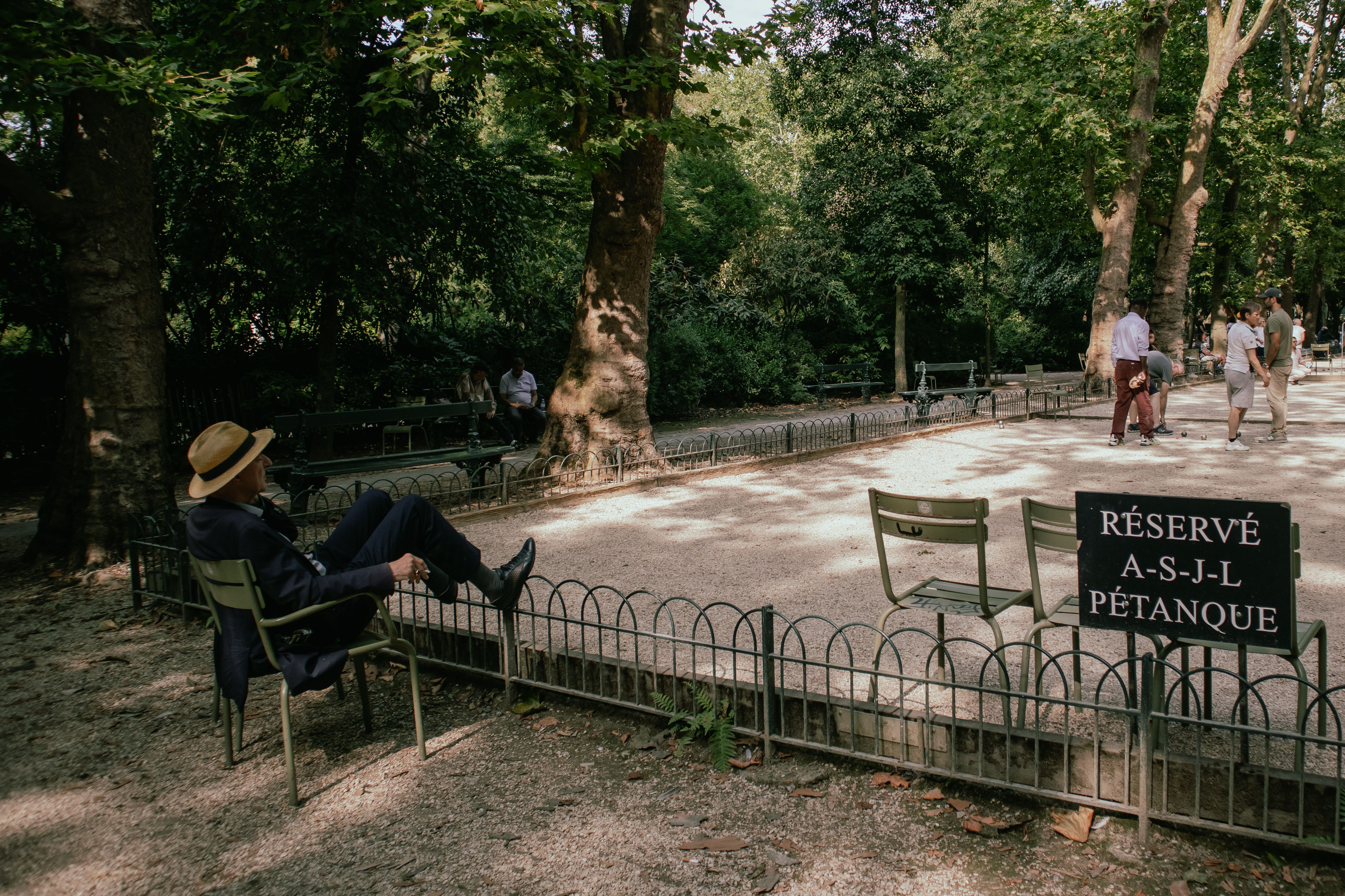 Relaxing at a French Park in Paris · Free Stock Photo