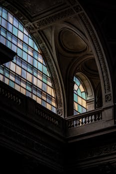 Explore the stunning Neo-Classical architecture of a Parisian church, showcasing intricate arches and stained glass windows.