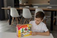 Boy with Construction Toy Box in Modern Interior