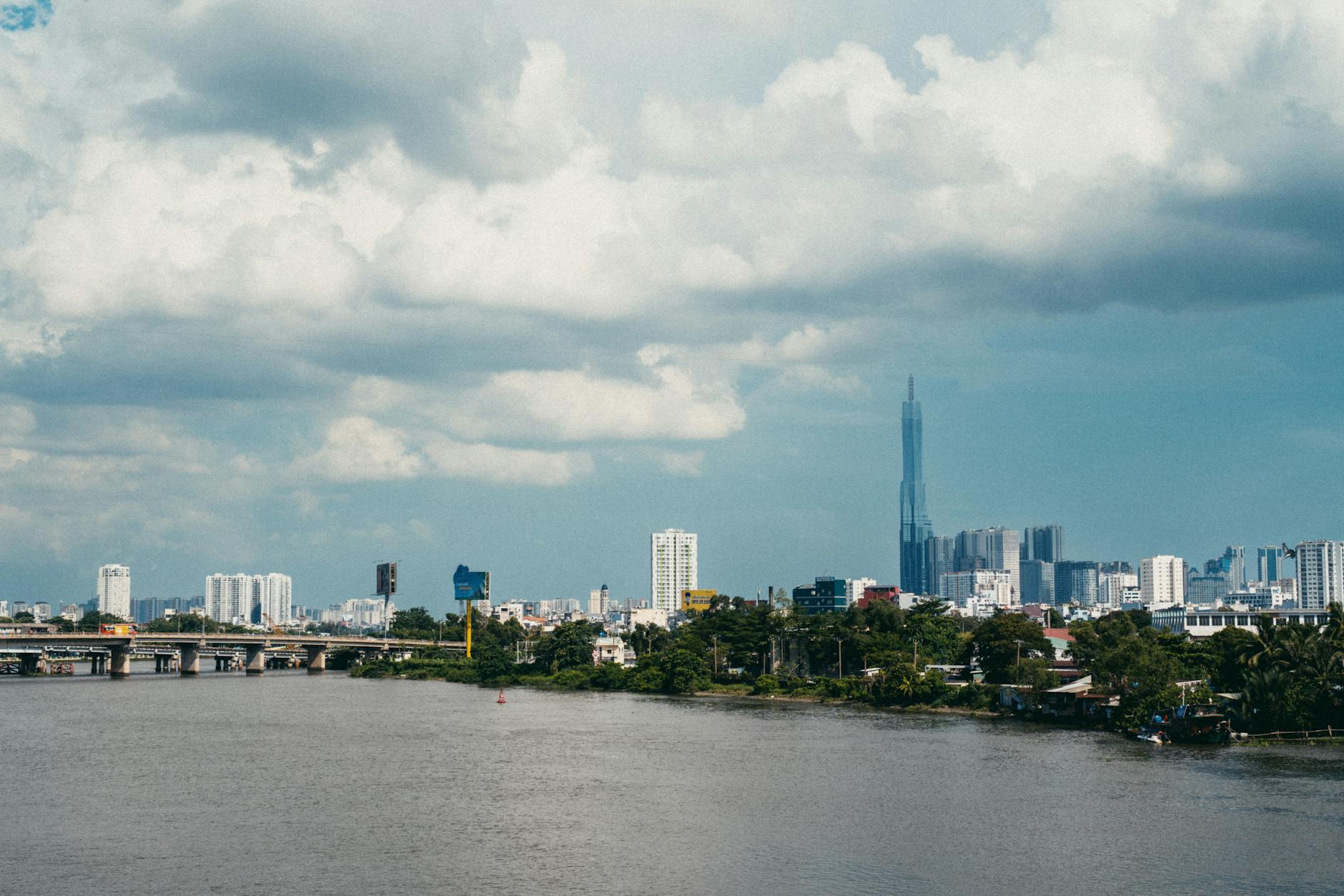 A captivating view of Saigon's skyline with dramatic clouds and the iconic Landmark 81.