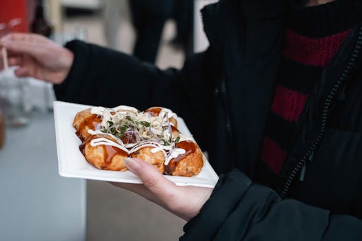 Close-up of takoyaki, Japanese street food, served outdoors in Berlin.