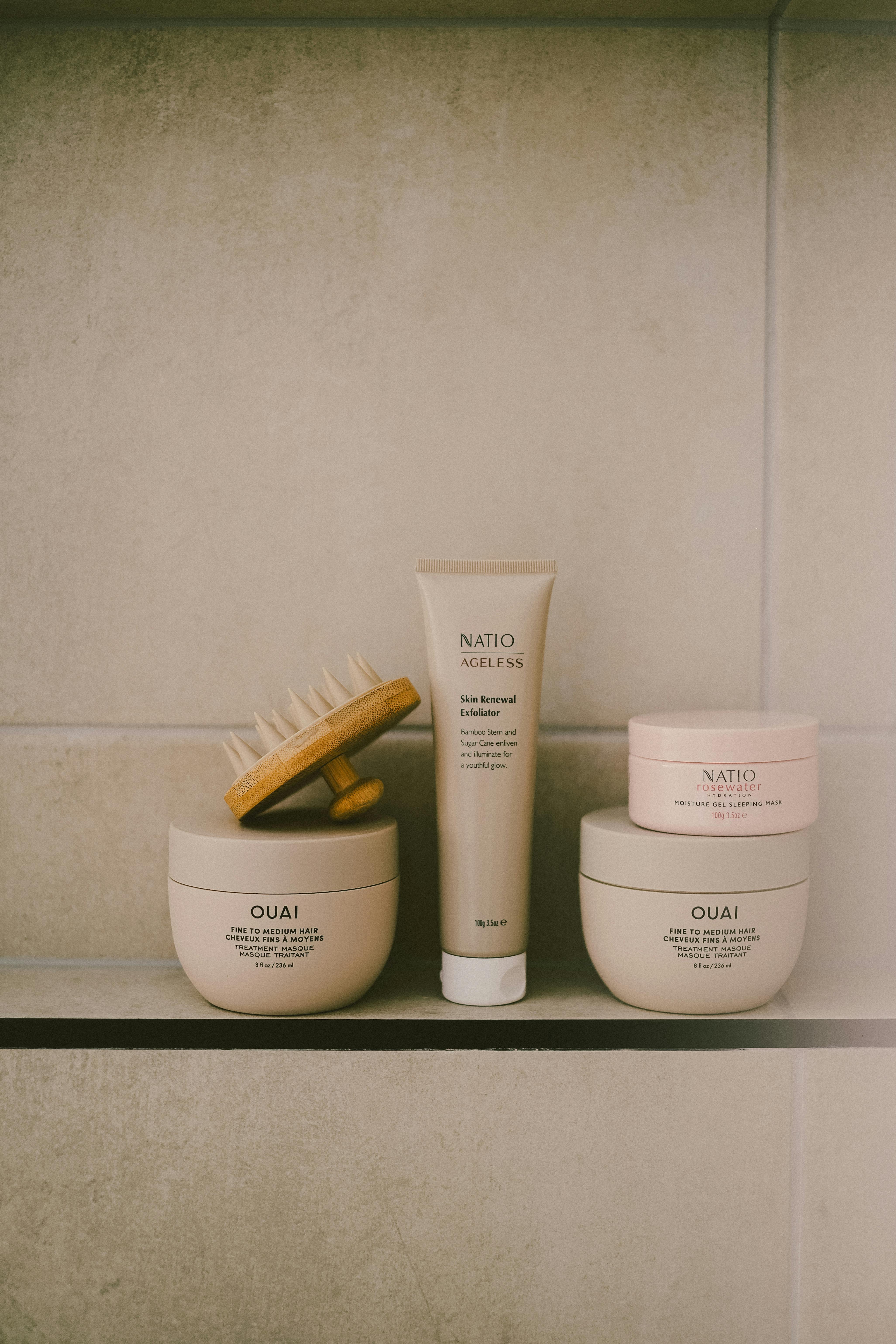 Aesthetic display of beauty products in a minimalist bathroom setting, emphasizing elegance and self-care.