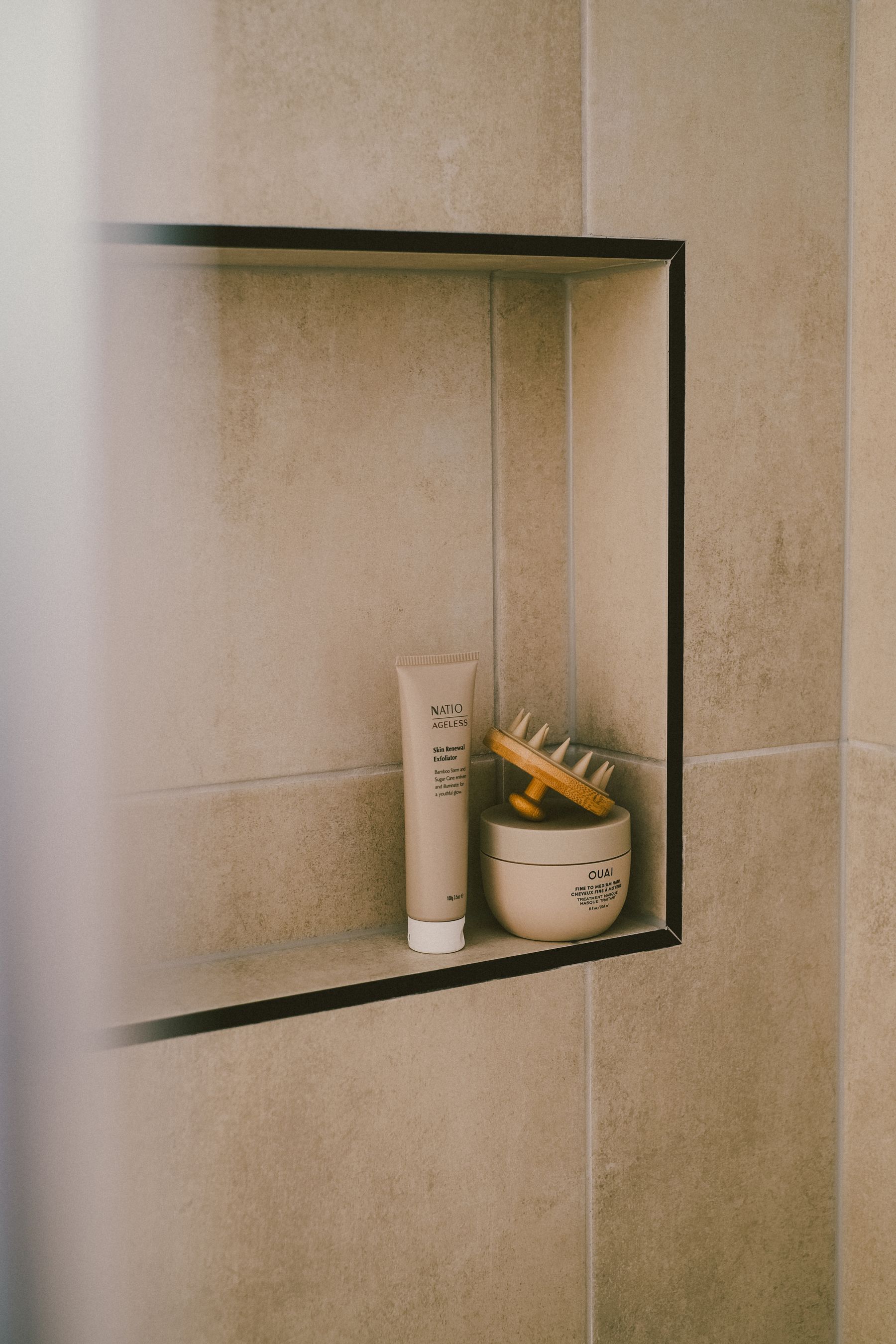 Modern bathroom shelf with personal care and beauty essentials