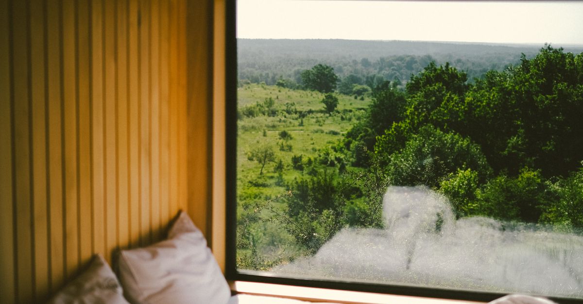 Modern Nightjet sleeper cabin with cozy lighting and made bed