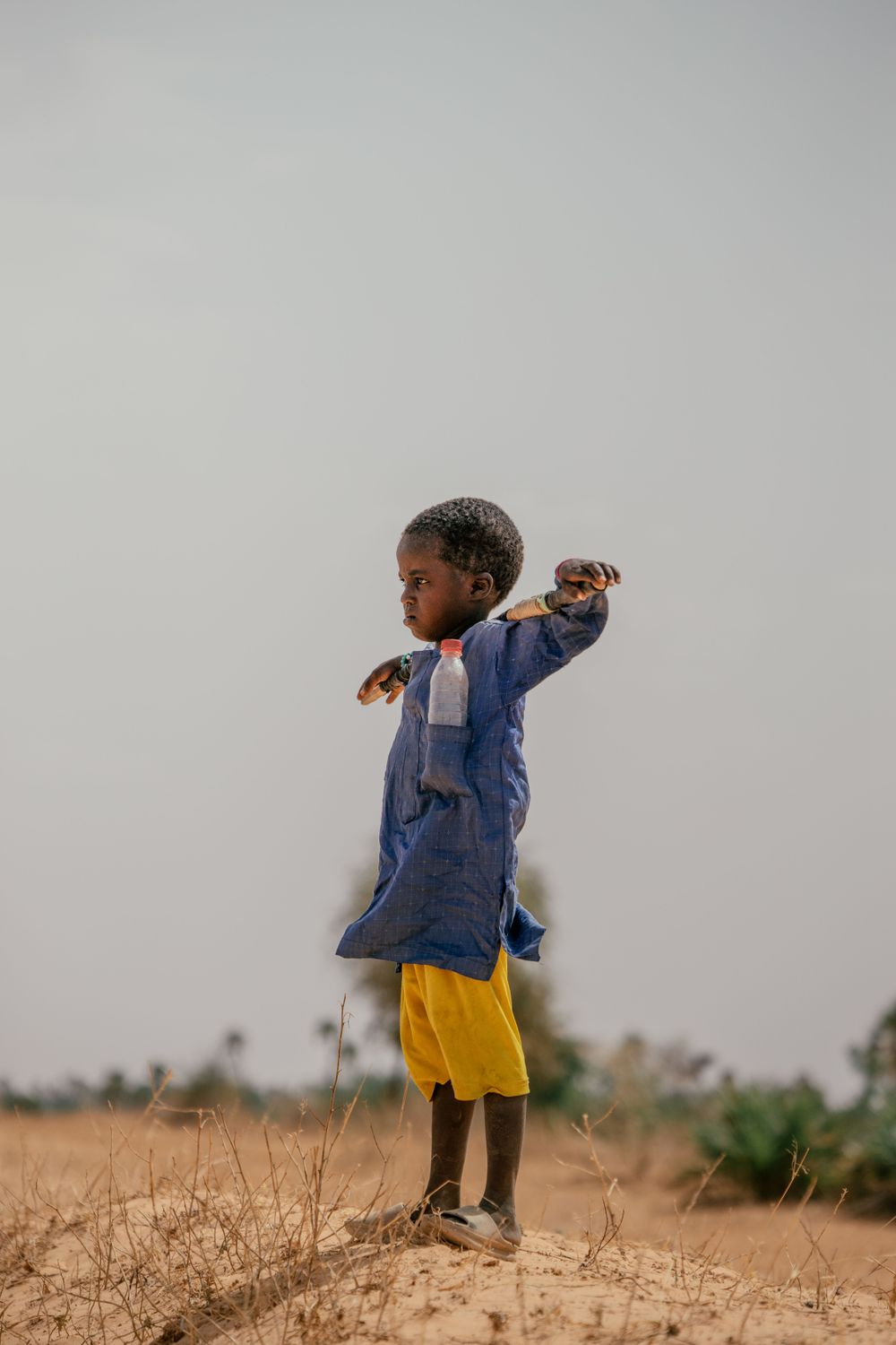 Young Boy in Traditional Clothing Outdoors · Free Stock Photo