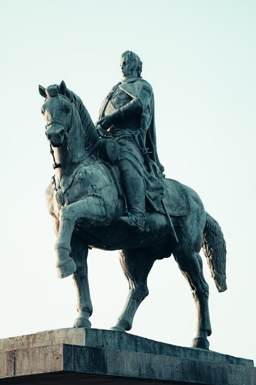 Free Dramatic equestrian statue of historic figure under clear blue sky. Stock Photo