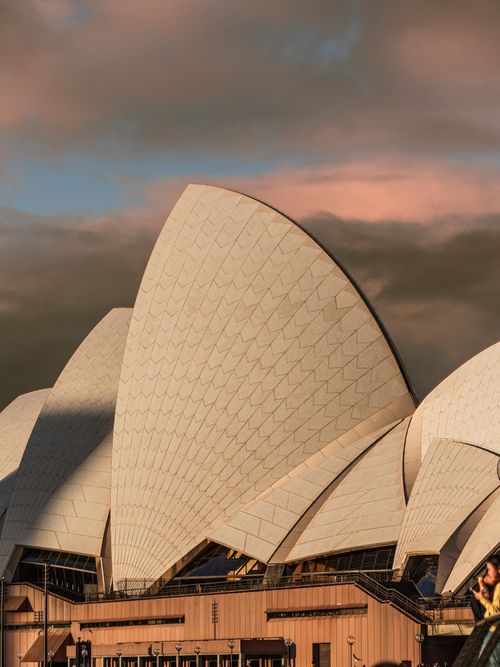Free A captivating view of the Sydney Opera House with vibrant skies in the background, highlighting architectural beauty. Stock Photo