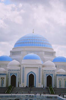 Stunning view of the mosque with blue domes in Astana, showcasing architectural beauty.