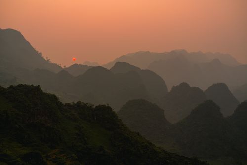 Free Experience the serene beauty of Hà Giang's mountains at sunset, Vietnam. Stock Photo