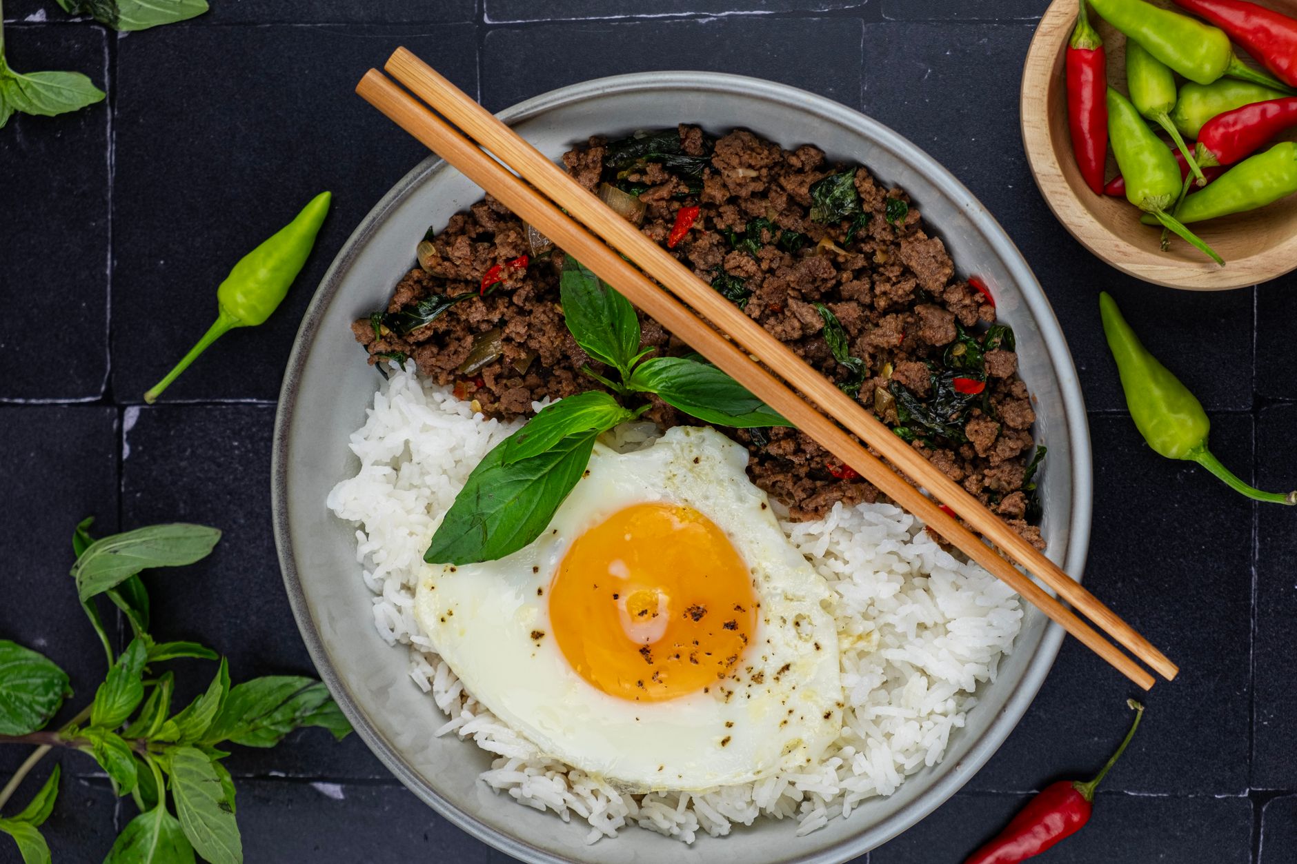 Close-up of fried eggs with crispy edges on Thai-style turkey stir-fry