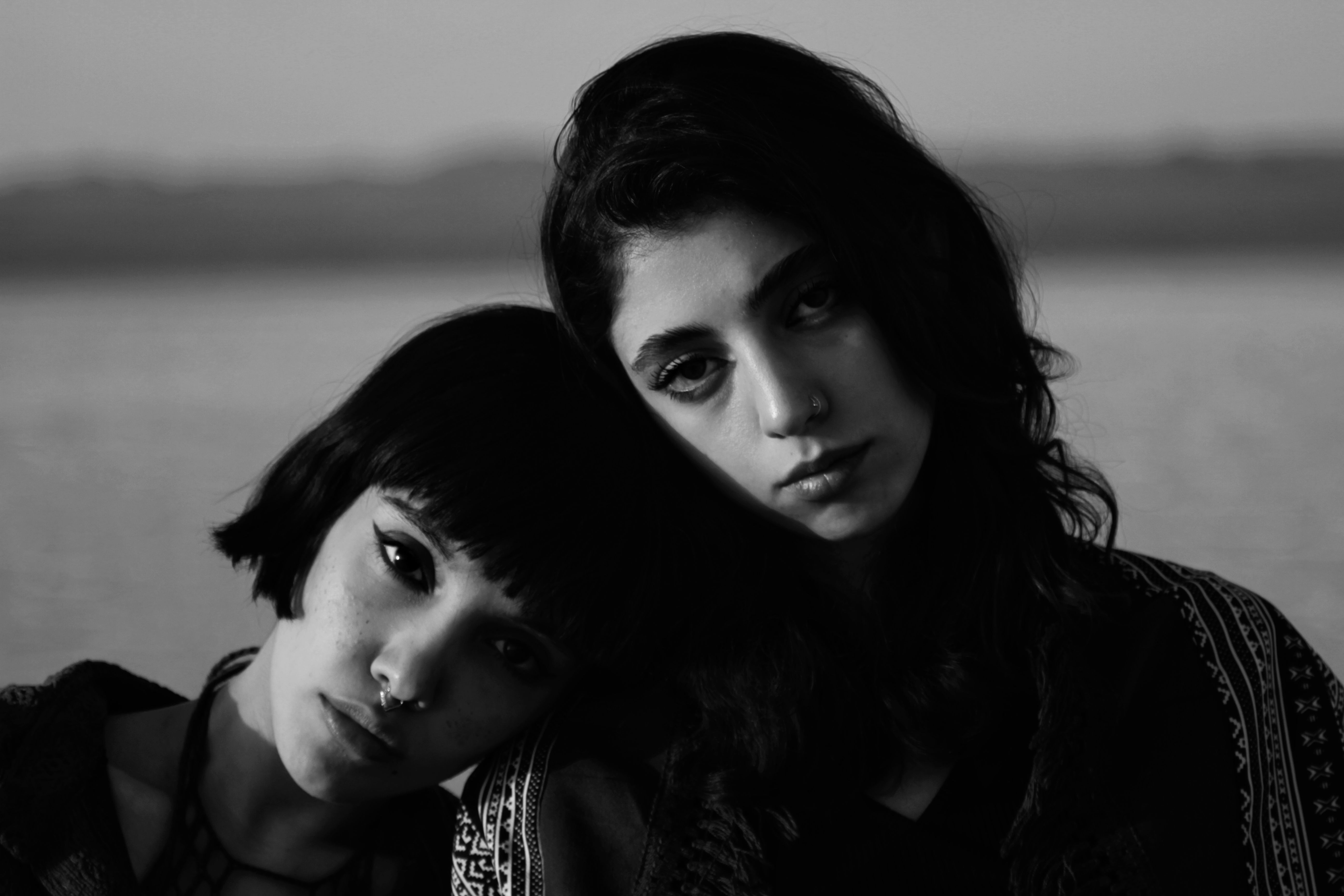 Black and White Portrait of Young Women Outdoors · Free Stock Photo
