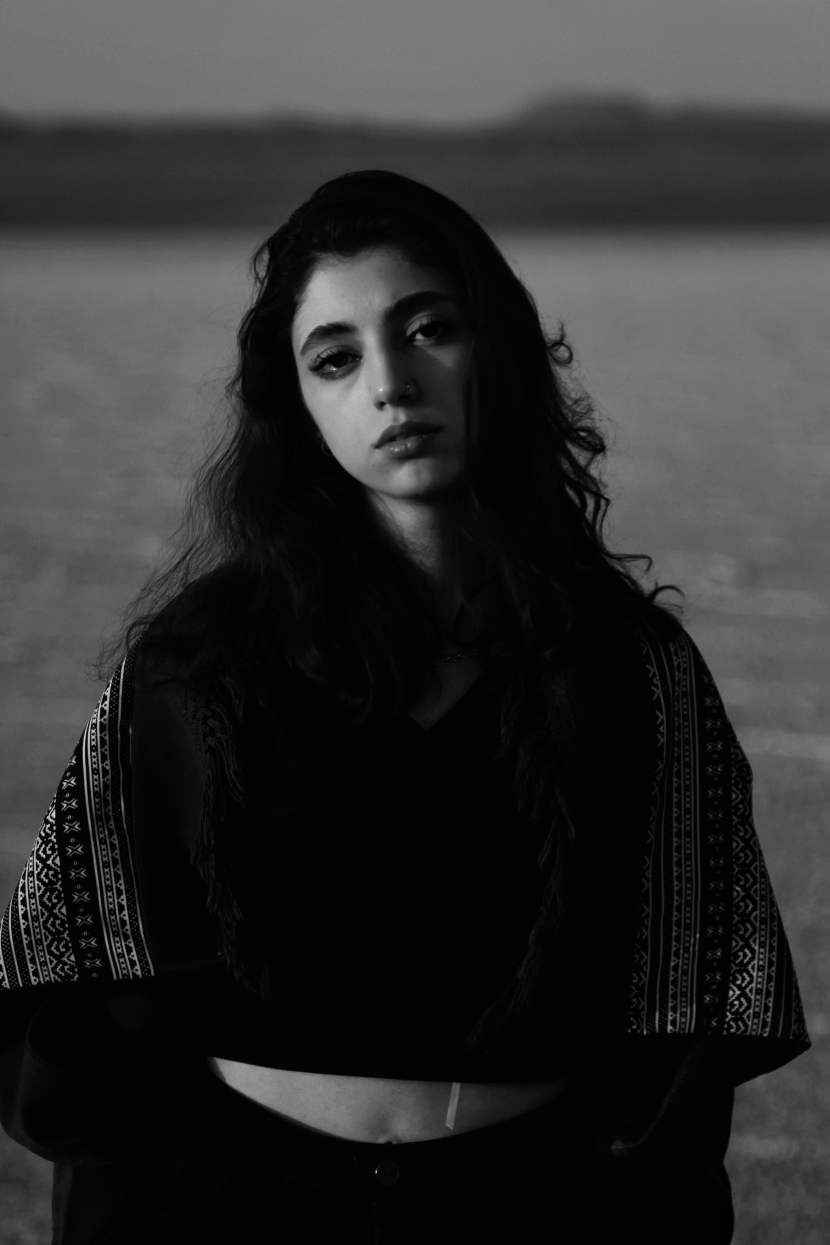Black and White Portrait of a Young Woman Outdoors · Free Stock Photo