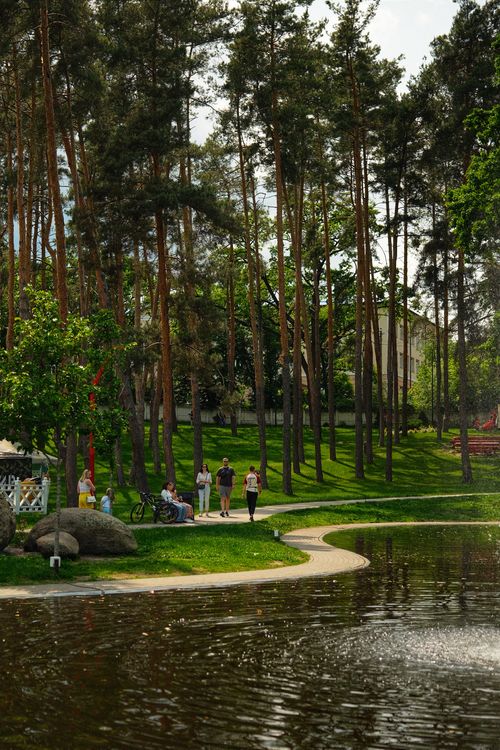 Free Peaceful park setting in Irpin, Ukraine with walking path and pond. Stock Photo
