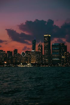Stunning view of Chicago's skyline with vibrant dusk colors over Lake Michigan.