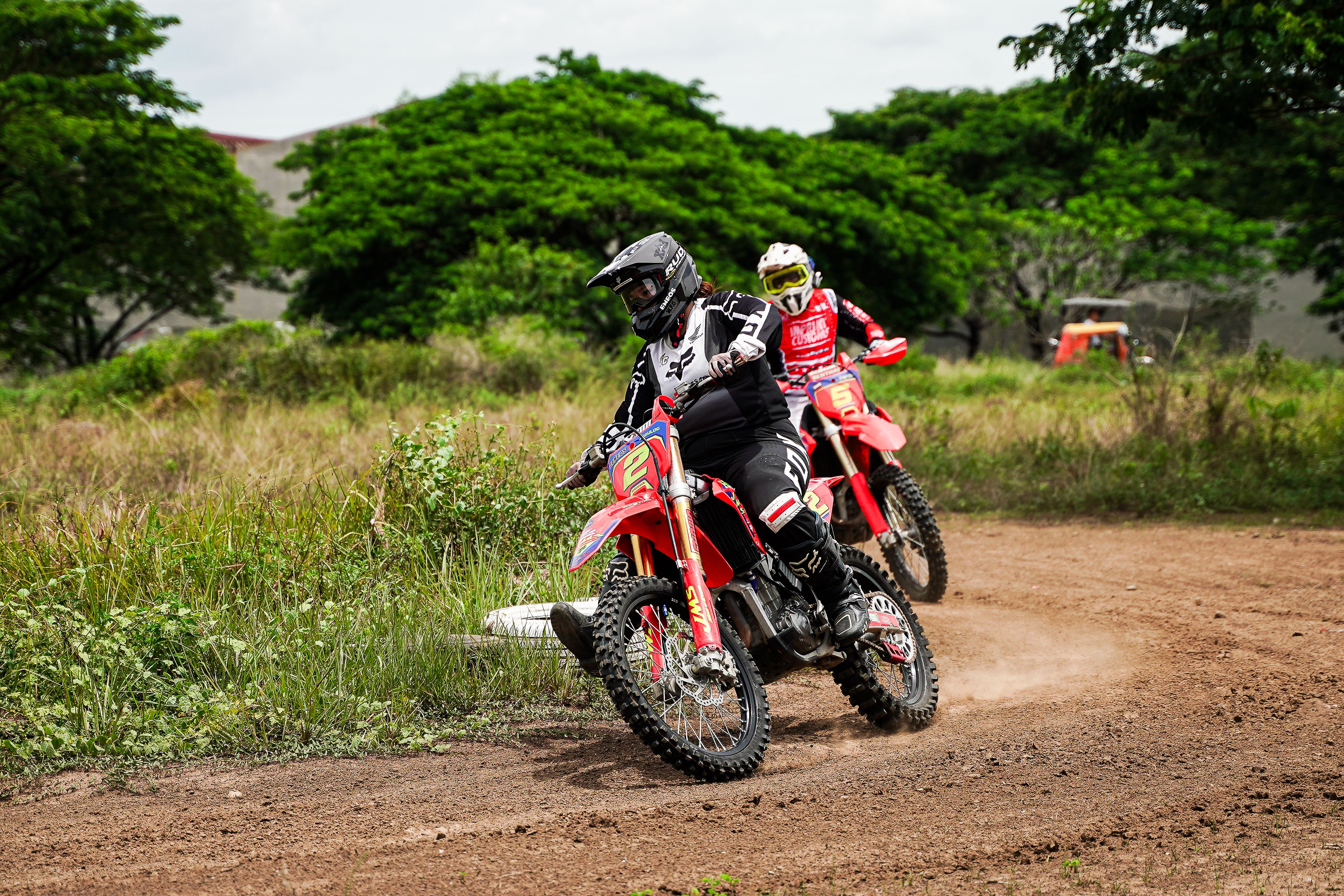 Off-road motorcycle race in lush Bulakan landscape · Free Stock Photo